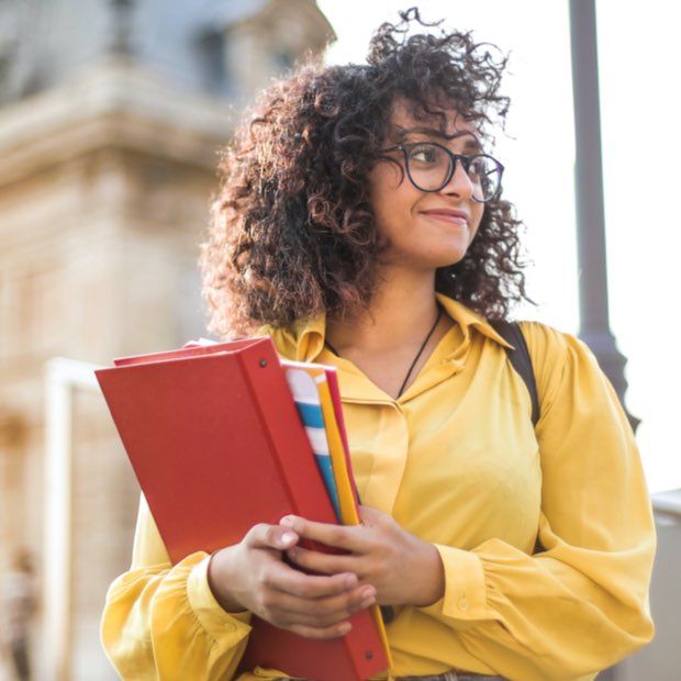 Woman student intern holding folders
