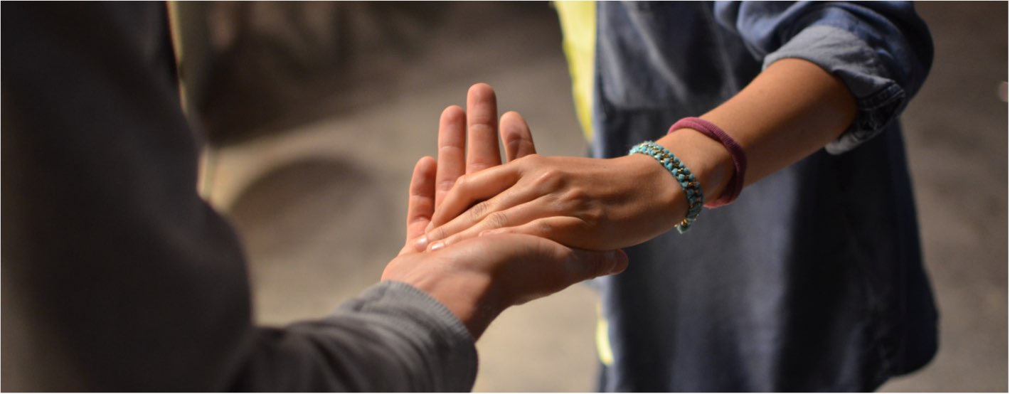 Potential patient being led by the hand by partner